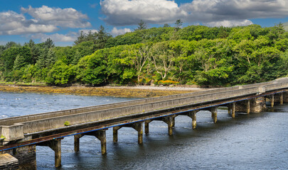 Irish rural landscape near the village of Cahersiveen in southern Ireland. With an bridge across...