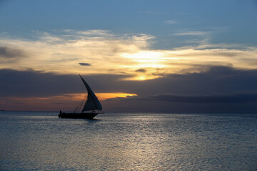 Fototapeta premium Sunset and boats in the sea, sunset on Zanzibar beach
