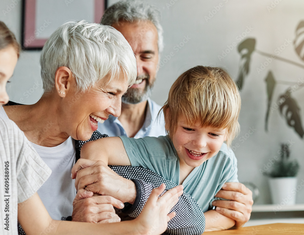 Wall mural grandchild family child grandparent grandfather happy together grandmother girl senior boy man woman smiling granddaughter grandson sofa