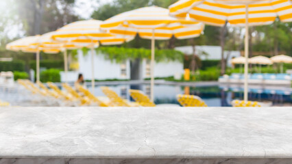 Empty marble stone table top and blurred swimming pool in tropical resort in summer banner background - can used for display or montage your products. - 609589168