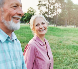 woman man senior portrait couple happy retirement together elderly active vitality park fun smiling...