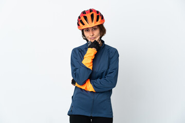 Young English cyclist woman isolated on white background thinking