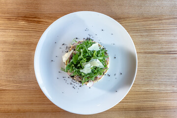 Prepared beef tongue served with mixed green vegetables salad