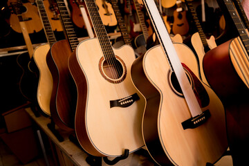 Fototapeta na wymiar Many rows of classical guitars in the music shop