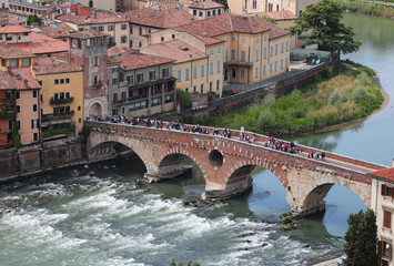 Verona in Italy and old Stone Bridge called PONTE PIETRA over Adige River