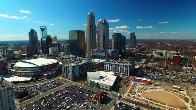 Aerial Shot Of Modern Buildings By Spectrum Center On Sunny Day, Drone Flying Forward Over City Against Sky - Charlotte, North Carolina