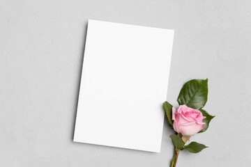 Blank wedding invitation or greeting card mockup with flower