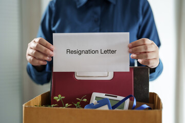 Business people giving a resign letter to quit a job at office..