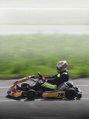 vertical panning of a fast pass of a racing go kart