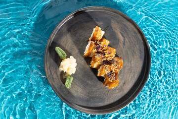 japanese cuisine sushi rolls on blue water background