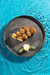 japanese cuisine sushi rolls on blue water background