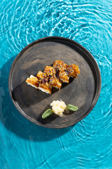 japanese cuisine sushi rolls on blue water background