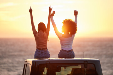 Sunset, women sitting on a car and at the beach with back view for carefree or peace. Freedom or...