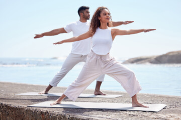 Couple yoga, beach and exercise outdoor in nature for fitness workout and wellness. African woman and a man at ocean for warrior pose, stretching or pilates training for peace, freedom or mindfulness