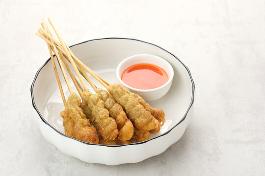 Sempol Ayam, made from minced chicken, spices and eggs. Served with chili sauce. Indonesian traditional food
