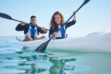 Couple, kayak and rowing boat on a lake, ocean or river for water sports and fitness challenge. Portrait of happy man and woman with a paddle for adventure, exercise or travel in nature with teamwork © Matthew Cerff/peopleimages.com