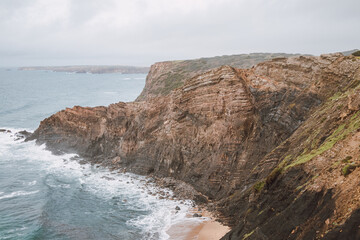 Fototapeta na wymiar Breathtaking beach of Praia da Manteiga with its high cliffs near Vila Do Bispo, Algarve, Portugal. Wandering the Rota Vicentina. Crossing the west coast