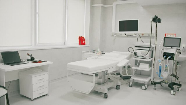 Medical equipment for gastroscopy in the office of the clinic a couch for patients and a gastroscopy with a monitor
