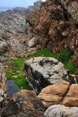 waves crashing on rocks at Pitstop Cape Town. South Africa