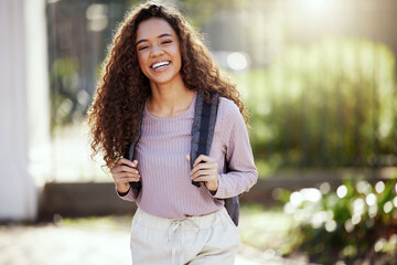 Portrait, happy woman with backpack and student in campus garden, university and education with...