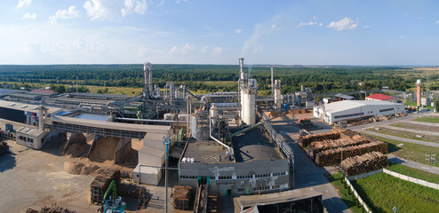 Aerial view of wood processing factory with stacks of lumber at plant manufacturing yard © bilanol