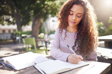 Writing, studying and woman with books outdoor in park, cafe or university campus, notes or exam...