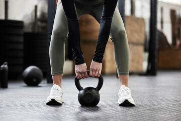 Kettle bell, fitness and woman in gym for weightlifting, bodybuilder training and strong muscles....