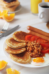 Traditional British breakfast with sausages and beans