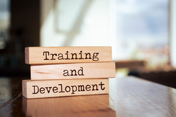 Wooden blocks with words 'Training and Development'.