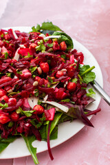 Healthy breakfasts or lunches, baked chickpeas and beetroot salad with goat cheese, mix of herbs and different seeds