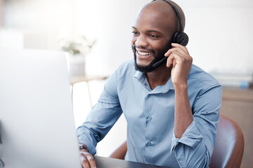 Black man, happy and agent working in call center on computer in the office, business in telemarketing or customer service. Businessman, face with smile and crm, conversation with client on help desk