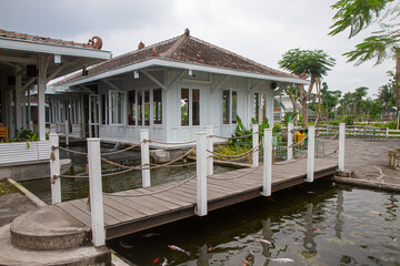 decoration design with koi pond and wood Bridge in garden