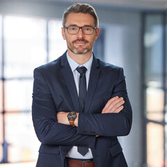 Portrait, business and man with arms crossed, career and startup success with confidence, ceo and employee. Face, mature male person or happy entrepreneur in a suit, professional and boss with skills - obrazy, fototapety, plakaty