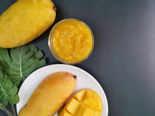 Mango smoothie on black background