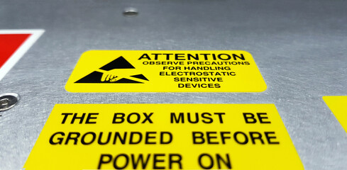 Standard caution label with text for Electrostatic Sensitive Devices (ESD) attached on electronic...