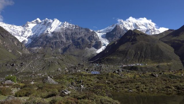 Everest Mountain Nepal wide shot
Green valley and village with snow covered mountain peaks,Nepal, 2023
