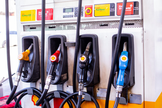BANGKOK , THAILAND - jUNE 5, 2023 : Shell gas pump nozzles in a service station, Close up fuel nozzles at Shell gas station, Panel and Dashboard of fuel nozzles of Gasohol and Diesel.