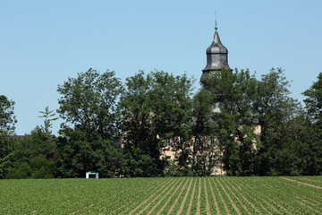 church in Germany located near the agricultural field - 609633185