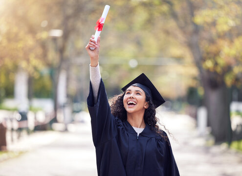 Success, university woman graduate and celebration outdoors with her certificate. Achievement or victory, college and happy student cheering for education on her graduation day with a lens flare