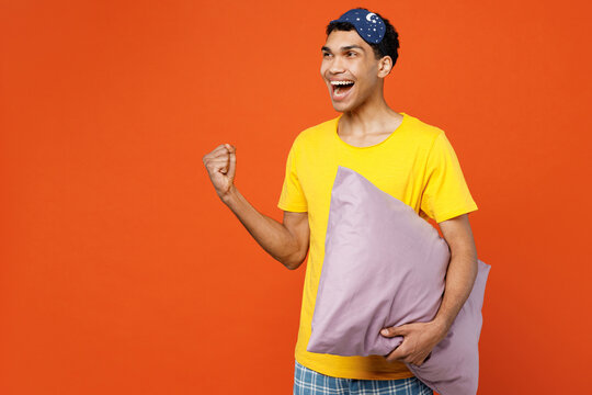 Side View Young Man He Wearing Pyjamas Jam Sleep Eye Mask Rest Relax At Home Do Winner Gesture Celebrate Clench Fists Say Yes Isolated On Plain Orange Background Studio. Good Mood Night Nap Concept.