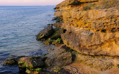 Rocky cliff shore, destroyed by sea waves in the Crimea