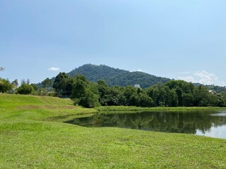 Fototapeta na wymiar taman tasik millenium in Malaysia. Natural hills garden lake togther