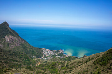 Breathtaking view while trekking to Teapot mountain in Jiufen Taiwan. View of the sea and mountains on a sunny day.
