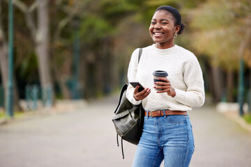 Phone, books and coffee with an african student woman on her commute to university campus for education. Mobile, social media and drink with a female college pupil thinking about her next lecture