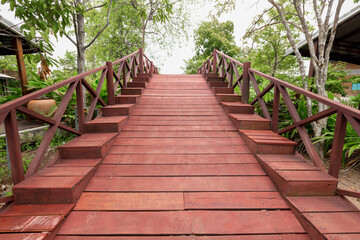 The Old red wooden bridge in the countryside.