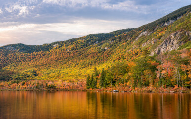 Autumn color reflection at the Basin Brook Reservoir in the White Mountains of New Hampshire 