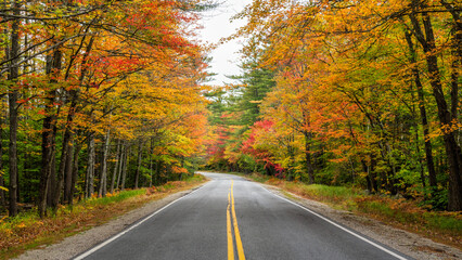 Naklejka na ściany i meble Rural road through western Maine in Autumn