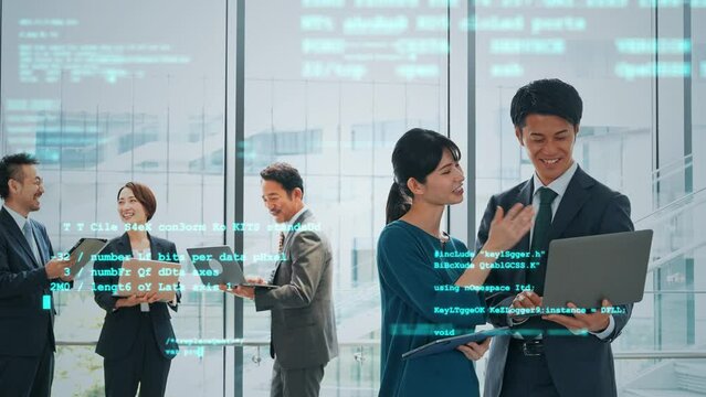 オフィスで会議する人々とデジタルテクノロジー