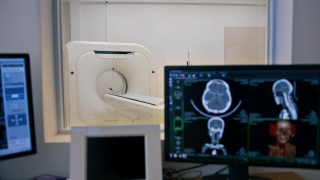 Computer tomography equipment in the clinic a screen with a tomographic image in the medical research room