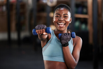 Portrait of boxer, dumbbell or happy black woman training, exercise or workout for a strong punch...